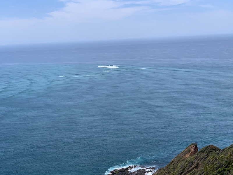 Waves intersecting Cape Reinga New Zealand