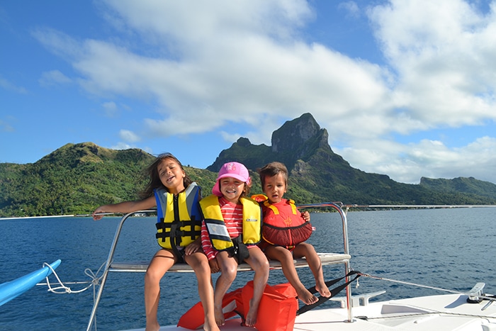 Kids enjoying a catamaran